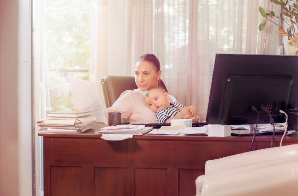 istock Multitasking mother with baby boy at home 1177062464