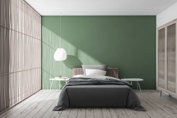 istock Stylish green and white bedroom interior 1177062808