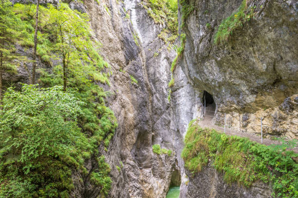 istock Canyon Kaiserklamm in Austria, hiking trail between steep rocks and green trees 1177062975
