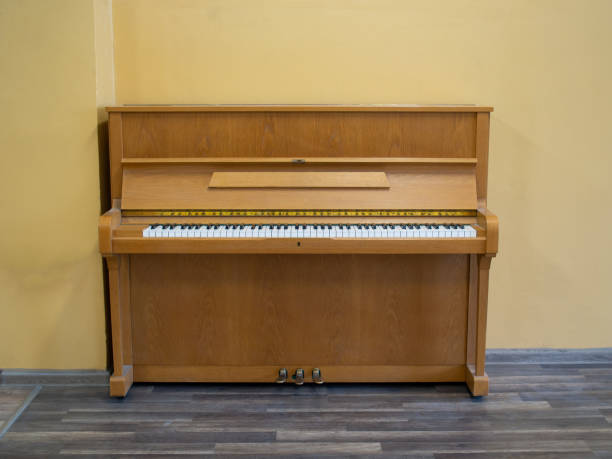 istock Light brown wooden piano instrument 1177063280