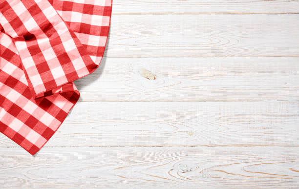 istock Napkin. Kitchen towel or table cloth on white wooden scene. Mock up for design. Top view. 1177064802