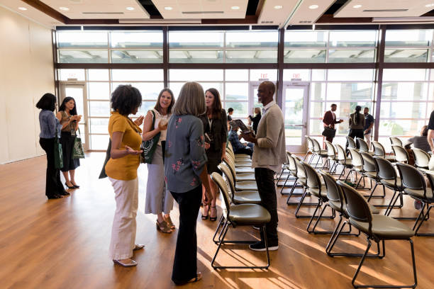 istock Diverse group of attendees chat during conference break time 1177065307
