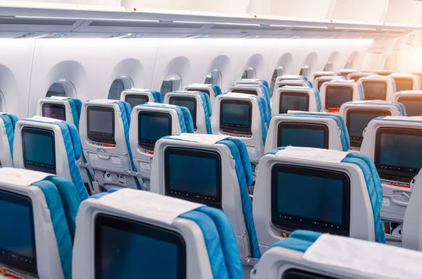 istock Passenger seats with a display for controlling and viewing multimedia files during airplane flight. 1177065438