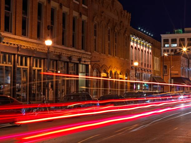 light trails downtown Springfield Springfield Missouri - September 13 2019 Old buildings in downtown Springfield on South Street with car light trails. springfield missouri photos stock pictures, royalty-free photos & images