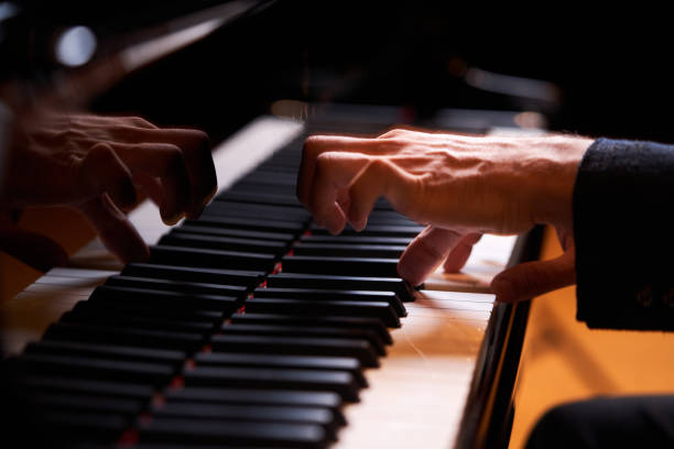 istock Closeup man's hand playing piano. Music performer's hand 1177068454