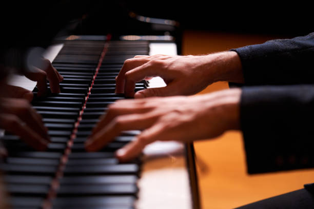 istock Closeup man's hand playing piano. Music performer's hand 1177068466