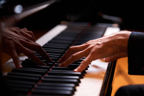 istock Closeup man's hand playing piano. Music performer's hand 1177068480