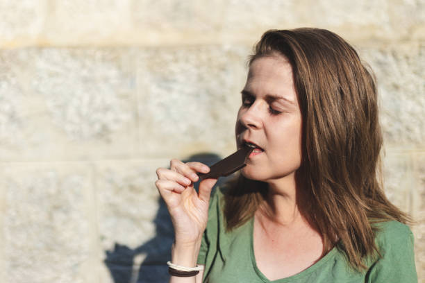 istock Girl eating some chocolate in the summer 1177075785