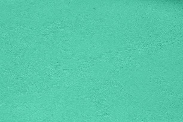 istock mint colored low contrast Concrete textured background with roughness and irregularities 1177075891