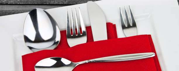 istock Cutlery on plate with napkin 1177083089