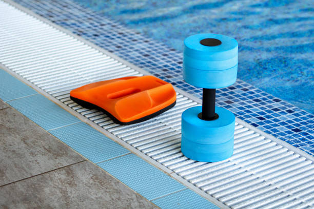 istock Swimming pool. Accessories for swimming. Board and dumbbell 1177083115