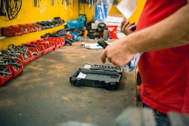 istock Car mechanic choosing the right extension for drill machine from toolbox 1177086851