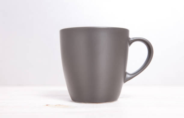 istock Mug Mockup. Gray Mug on wooden table. 1177088437