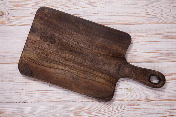 istock Cutting board on the wooden background. Top view. 1177088438