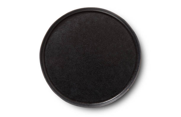 istock Black plate with shadow isolated on white background. Top view mock up. 1177088442
