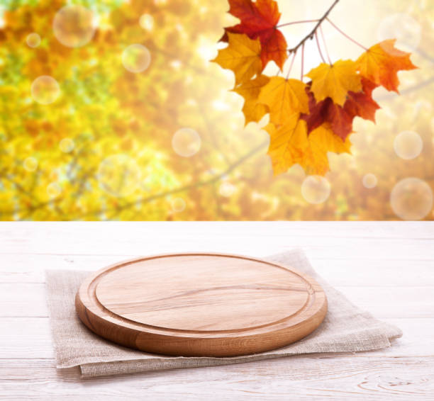 istock Pizza board with tableclothe on wooden desk. Autumn background. Top view mock up. Selective focus. 1177088678
