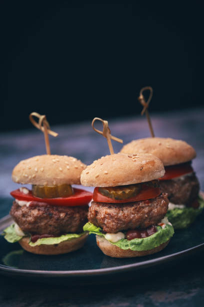 istock Mini Burgers with Tomato, Onion and Lettuce 1177090431