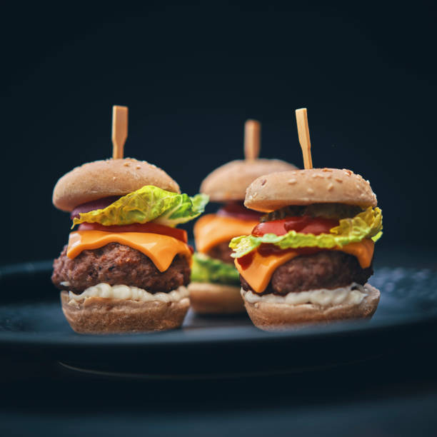 istock Mini Burgers with Tomato, Onion and Lettuce 1177090437