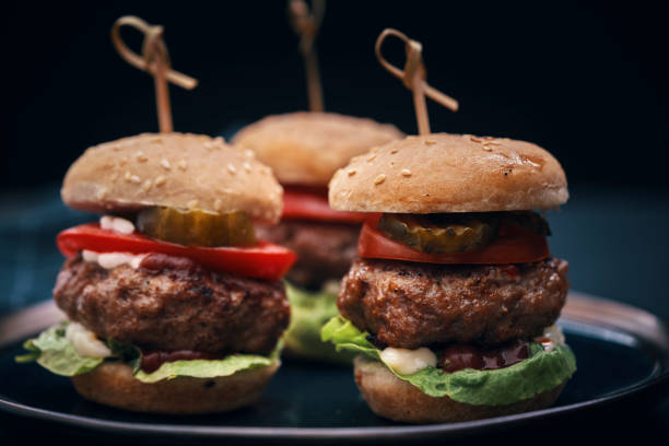 istock Mini Burgers with Tomato, Onion and Lettuce 1177090450