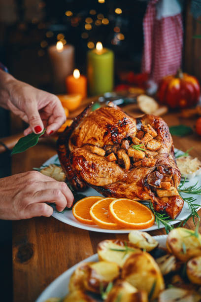 istock Preparing Stuffed Turkey for Holidays in Domestic Kitchen 1177090470