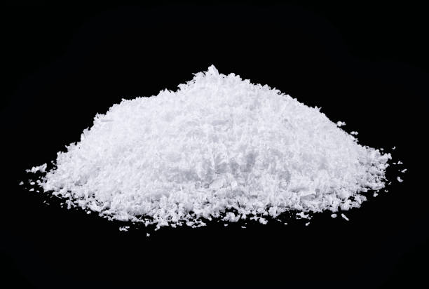 istock Heap of white snow isolated on black background 1177097220