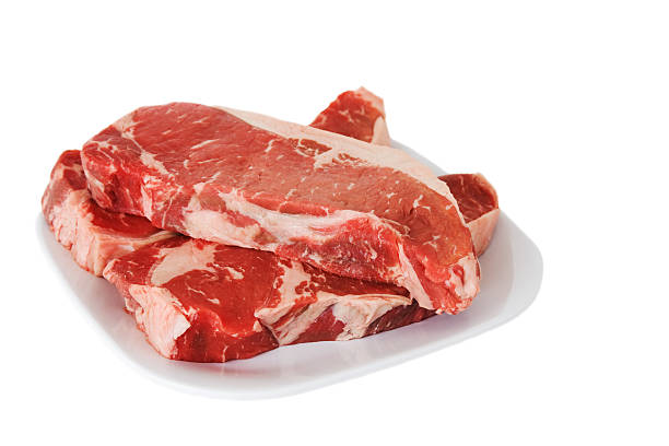 istock Raw New York Strip Steaks on a Plate 117709871