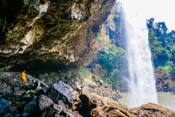 istock Monk under the Phu Chong waterfall in Vietnam 1177105327