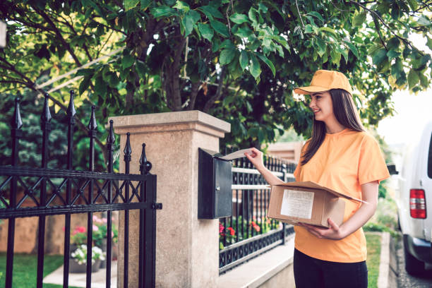 istock Cute Female Delivering Letters In Mail Box 1177107582