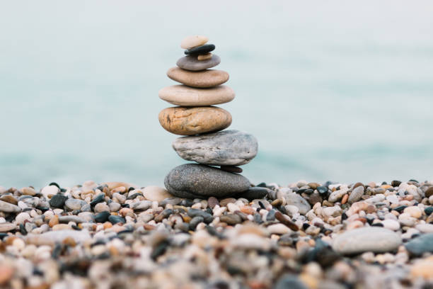 istock Stack of pebble Stones on ocean background. Peaceful and calm concept 1177107945