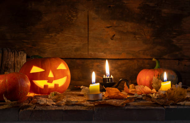 istock Halloween pumpkins head jack o lantern on wooden table background 1177109442
