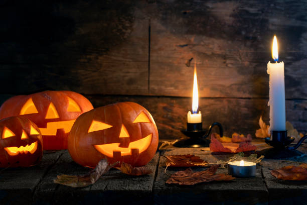 istock Halloween pumpkins head jack o lantern on wooden table background 1177109479