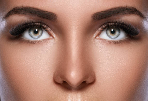 istock Female face with beautiful eyebrows and artificial eyelashes 1177115192