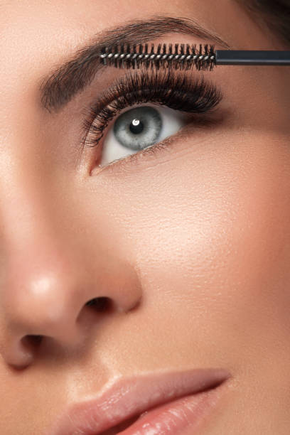 Beautiful woman with eyelash extension Beautiful woman with eyelash extension for maximum volume false lashes stock pictures, royalty-free photos & images