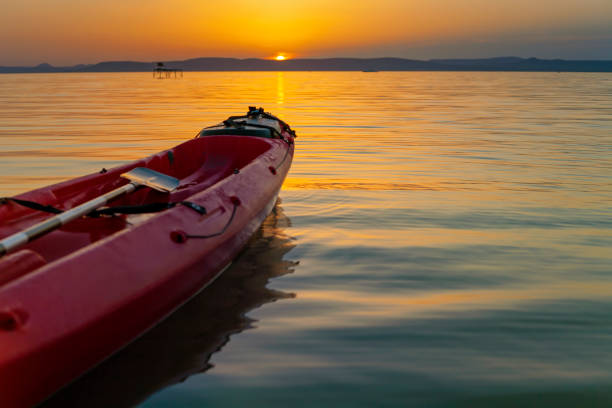 istock Lake Balaton sunset with a kayak in the front. 1177116223