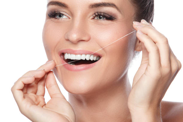 istock Woman and dental floss 1177117157