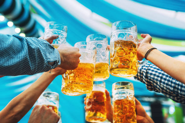 beer glasses in tent at Octoberfest in Munich Beer at Beer Fest, Munich, Germany oktoberfest beer stock pictures, royalty-free photos & images