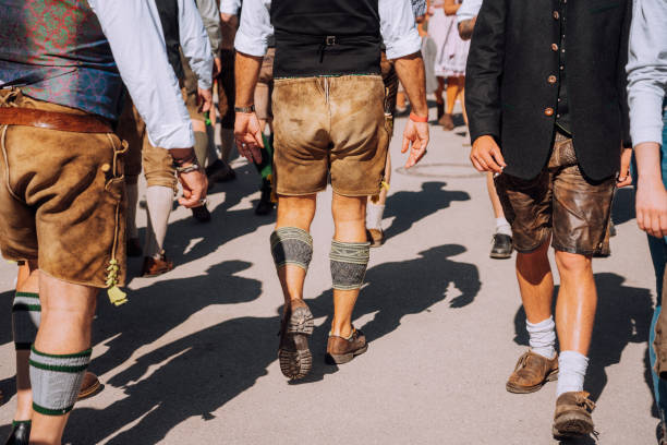 beer fest, munich, visitors walking through beer festival fairgrounds - carnival amusement park amusement park ride traditional festival imagens e fotografias de stock