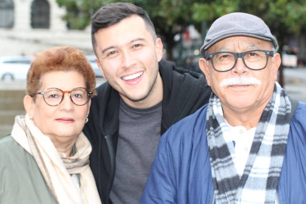 istock Hispanic man with his parents outdoors 1177119494