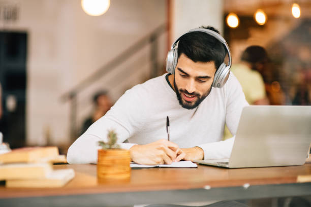istock Student working with Laptop in Coffee Shop 1177119797