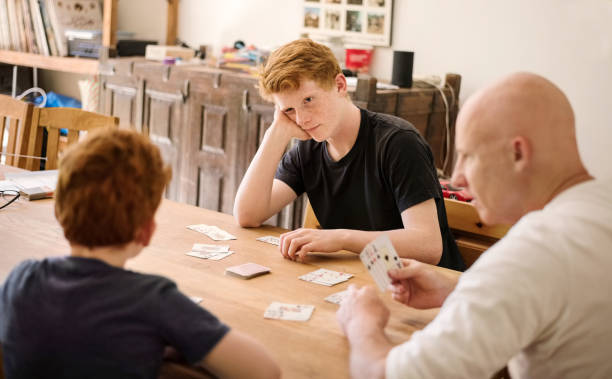 istock Family playing cards together 1177127060