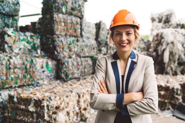 istock Smiling woman sanitary inspector visiting recycling center 1177130880