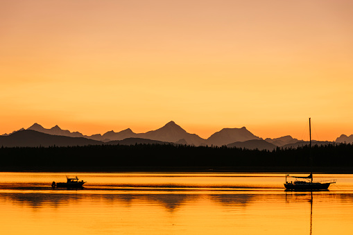 Orange sunset sky over the Fairweather range from Bartlett Cove, Glacier Bay National Park