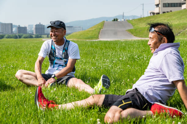 istock Senior man relaxing on grass after sports 1177146045