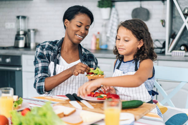 istock Mother and daughter in the kitchen 1177154676