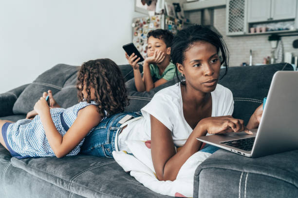 istock Mixed race family with digital devices 1177154681