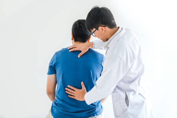 istock Physical Doctor consulting with patient about Back problems Physical therapy concept 1177154905