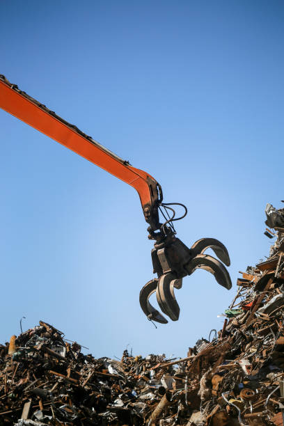 istock Industrial claw machine, move scrap metal in the landfill 1177156566