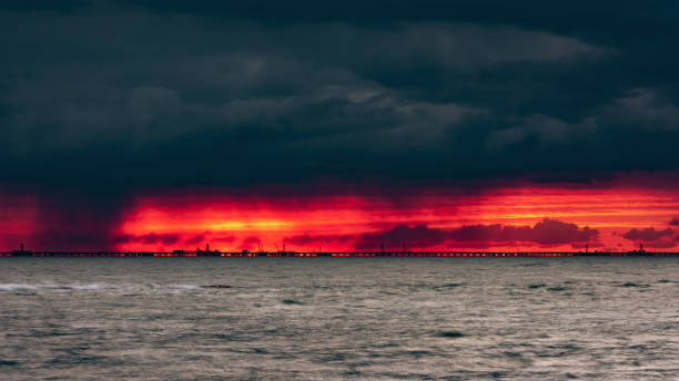 Ominous fiery dawn on the sea