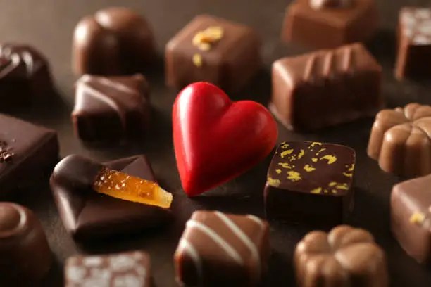 Photo of A collection of Valentine chocolates with heart-shaped chocolate