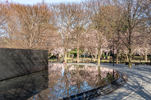 Tourists walk along the path next to the Korean War Memorial in West Potomac Park, just south of the Reflecting Pool.